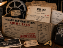 Star Trek Cold Cases evidence box containing an original-series communicator, tricorder, command insignia, film reels and the script for “Turnabout Intruder.”